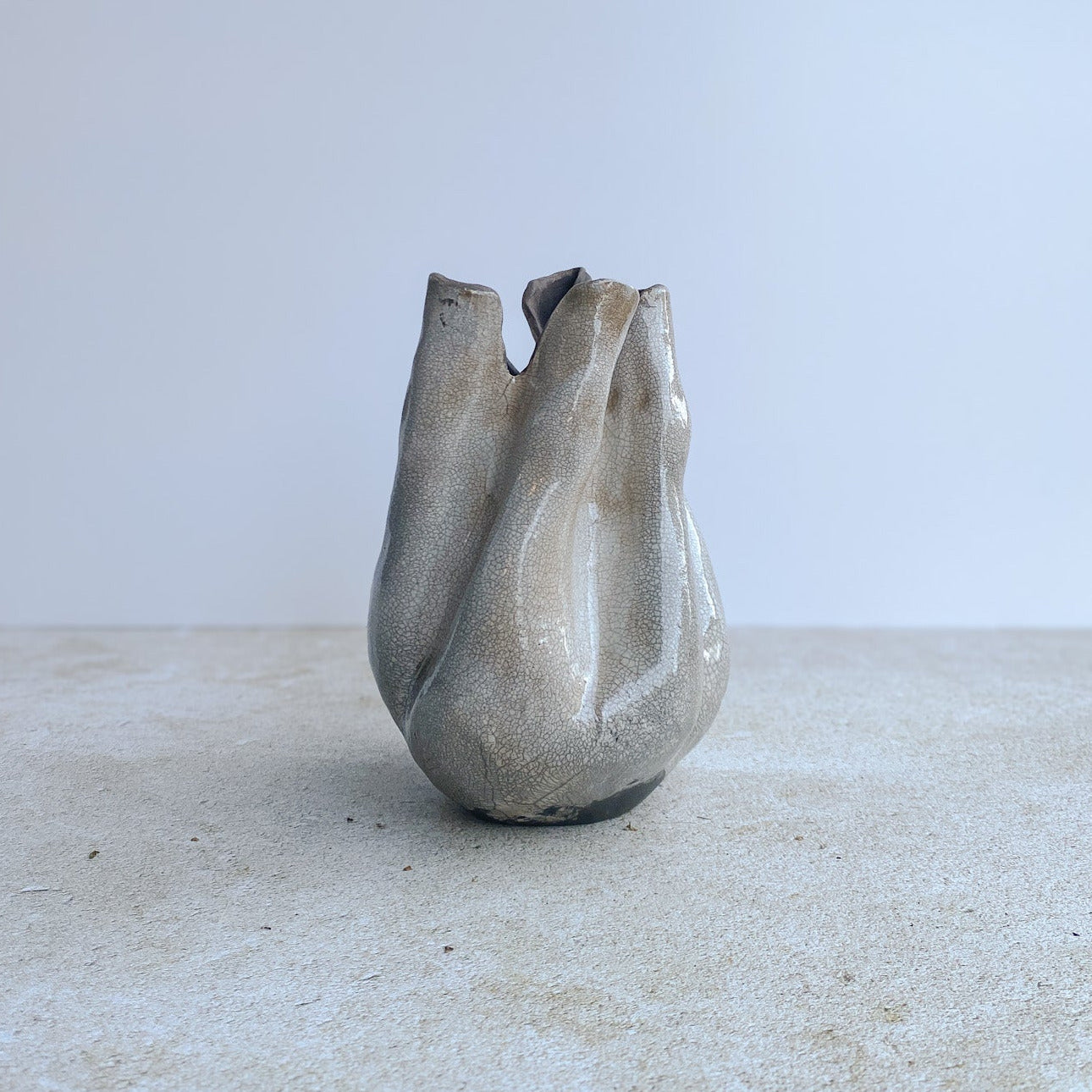 Ceramic vase with unique design on a light surface